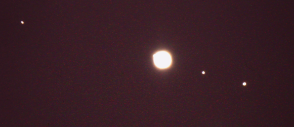 Overexposed Jupiter and its moons. My archival image.